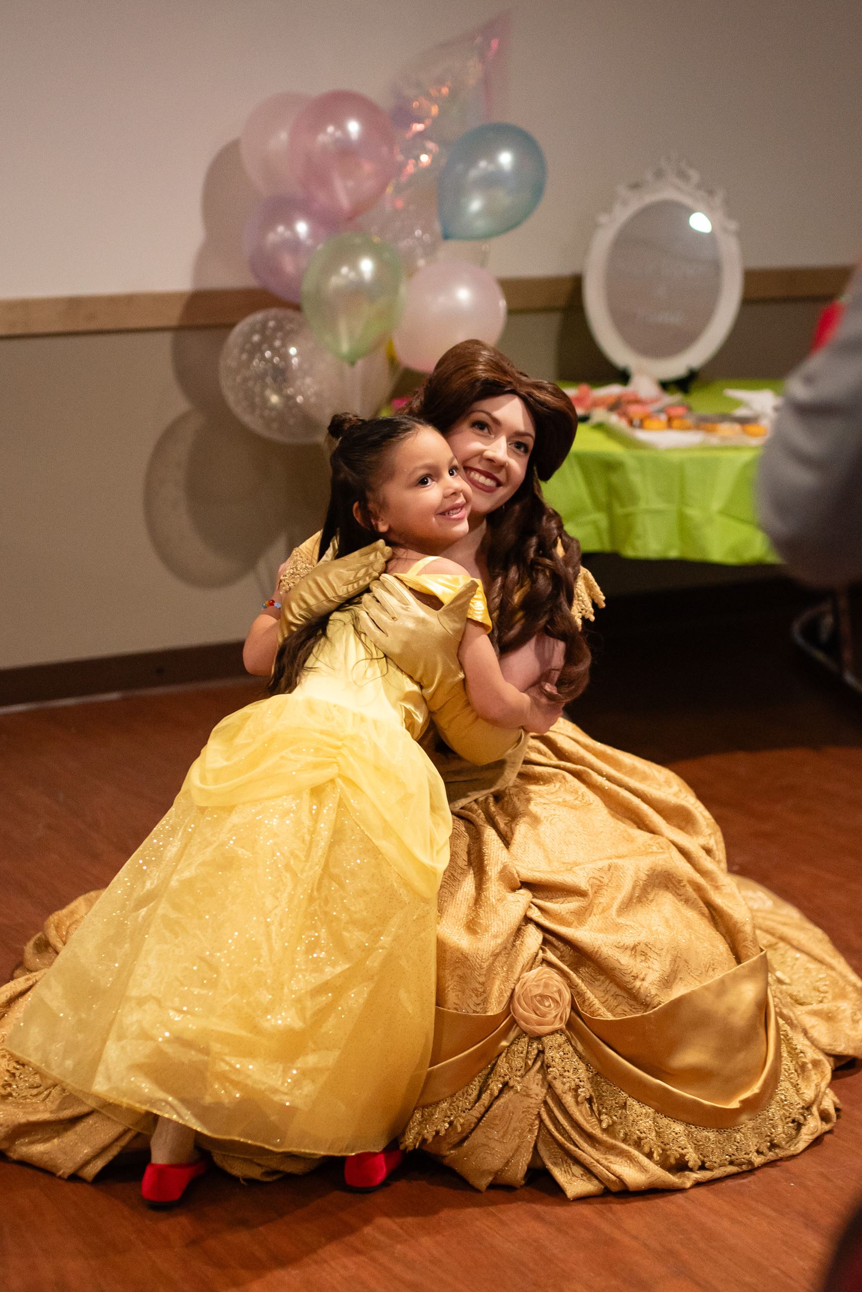 Young girl posing with a Disney Princess at the GBT Daddy Daughter Dance